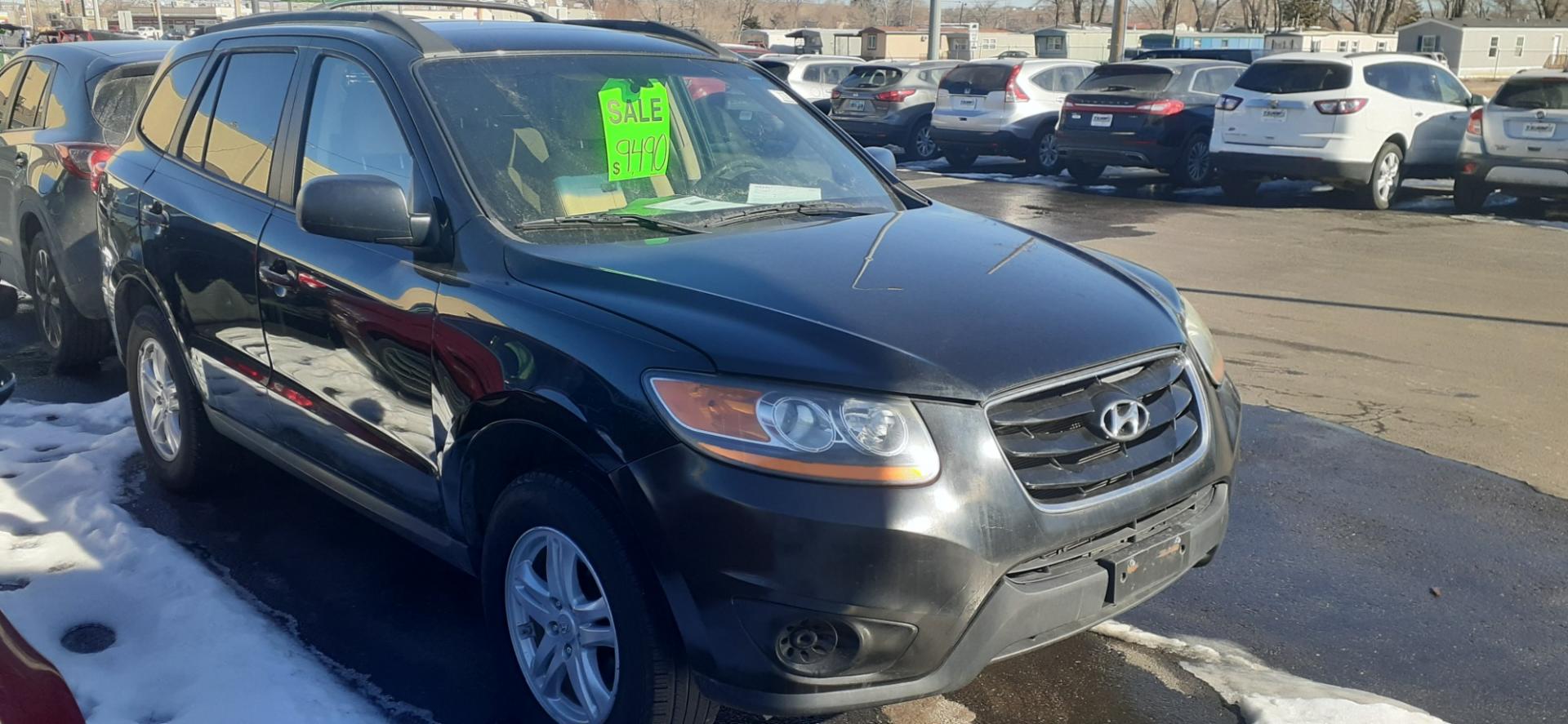 2010 Hyundai Santa Fe GL 4WD (5NMSGDAB9AH) with an 2.4L L4 DOHC 16V engine, located at 2015 Cambell Street, Rapid City, SD, 57701, (605) 342-8326, 44.066433, -103.191772 - CARFAX AVAILABLE - Photo#2